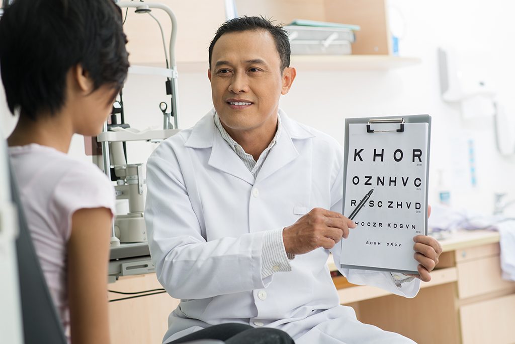 Doctor,Pointing,At,Eye,Chart